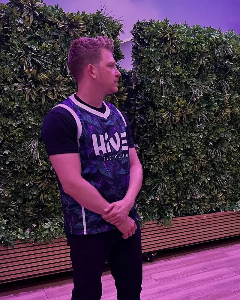 Brandon speaking at Hive Fit Club beside the gym owner